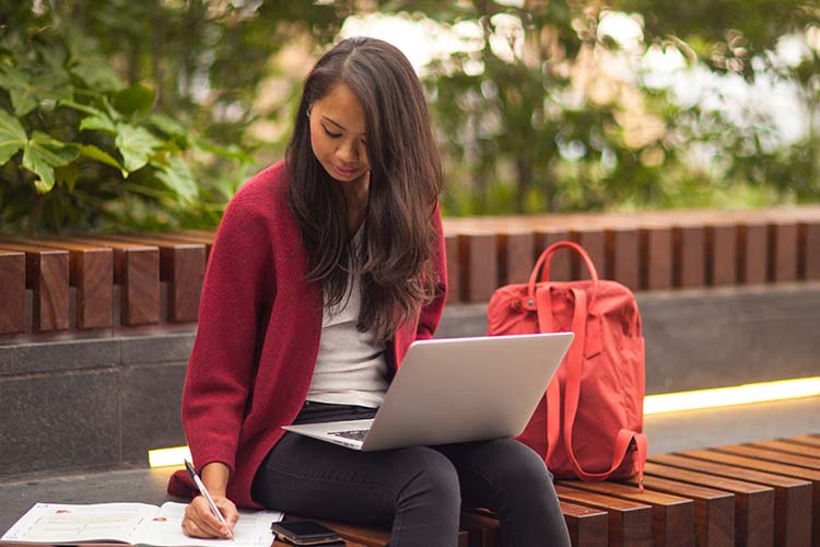 Image- Asian student writing