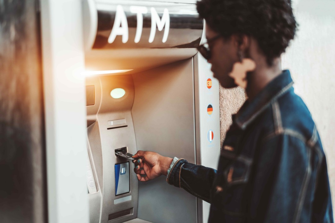 Image, a girl using ATM