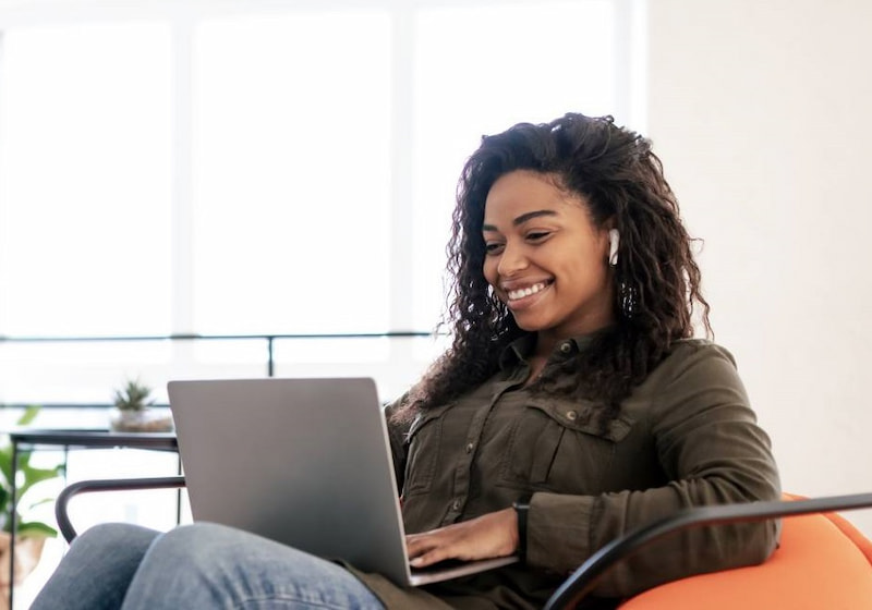 [Asset] PTE prep cropped - woman studying on sofa with laptop