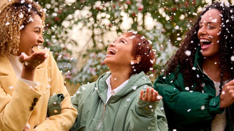 women-laughing-in-snow