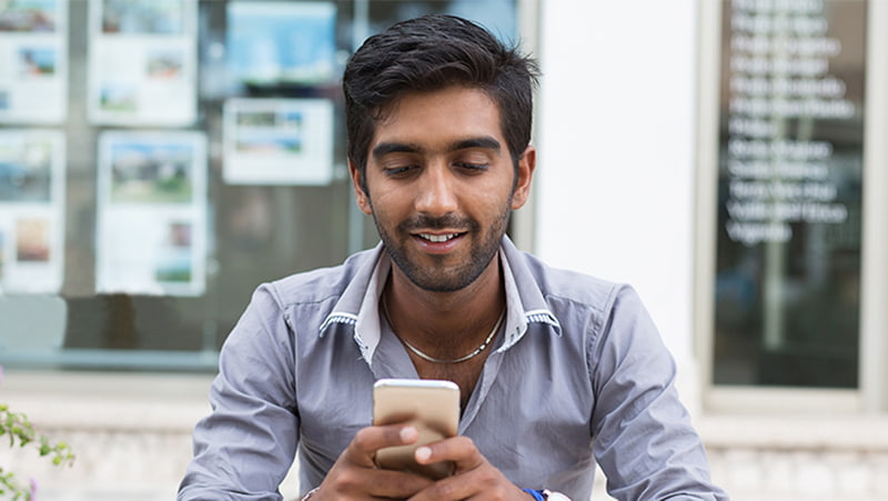 Image- a guy using phone, 800px
